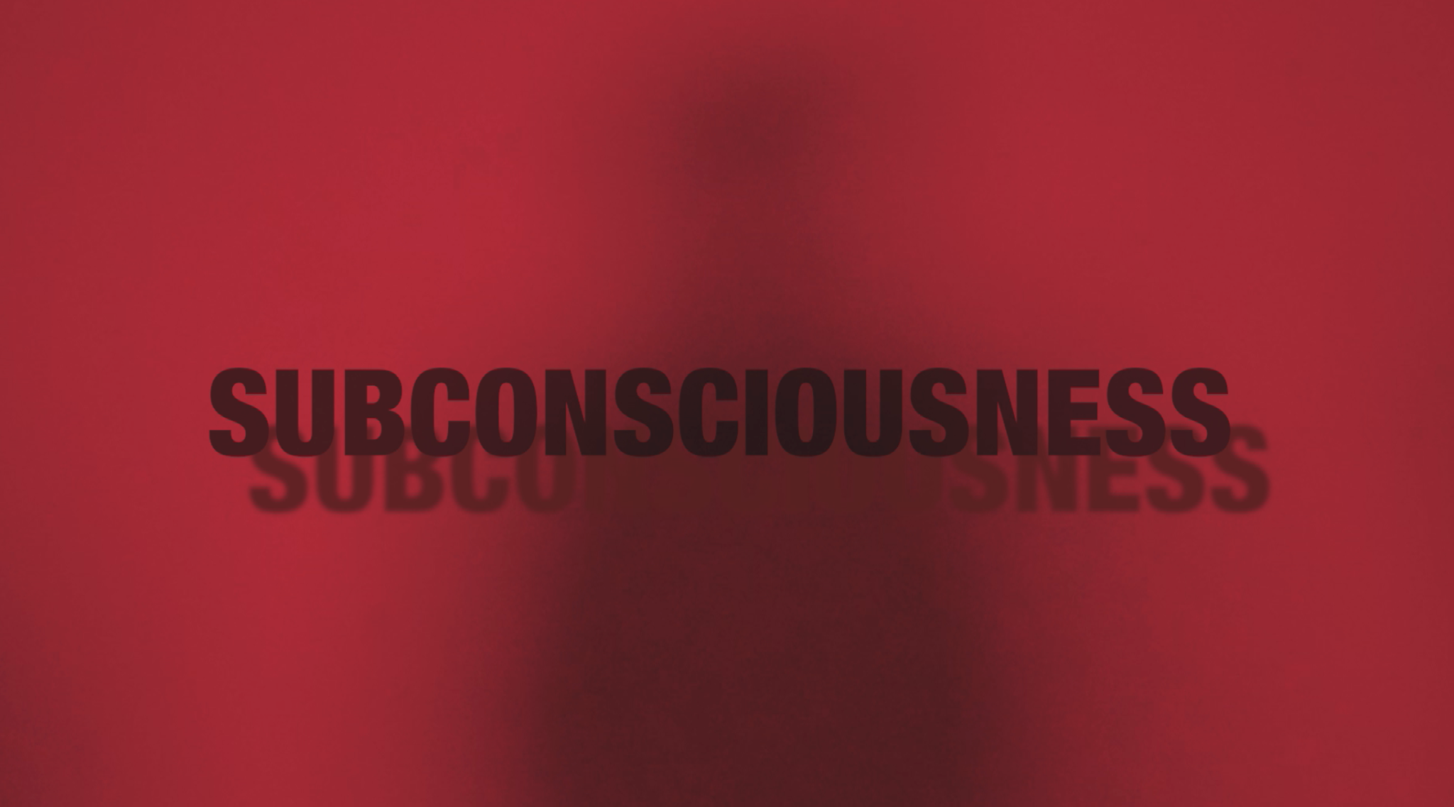 Subconsciousness video still with red background and blurred title text